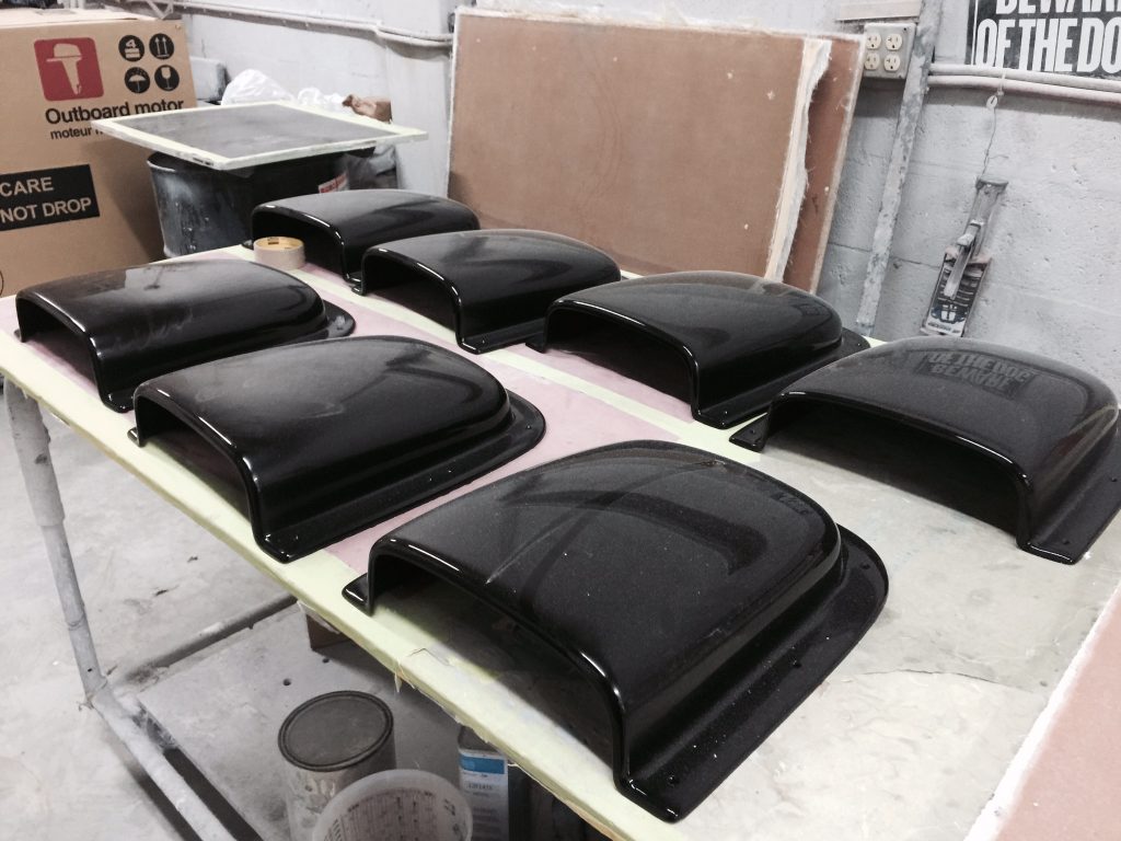 Fiberglass air scoops, soon to be mounted on the engine hatches, were pulled from tooling created by hand based on the shape of the originals in old photographs.