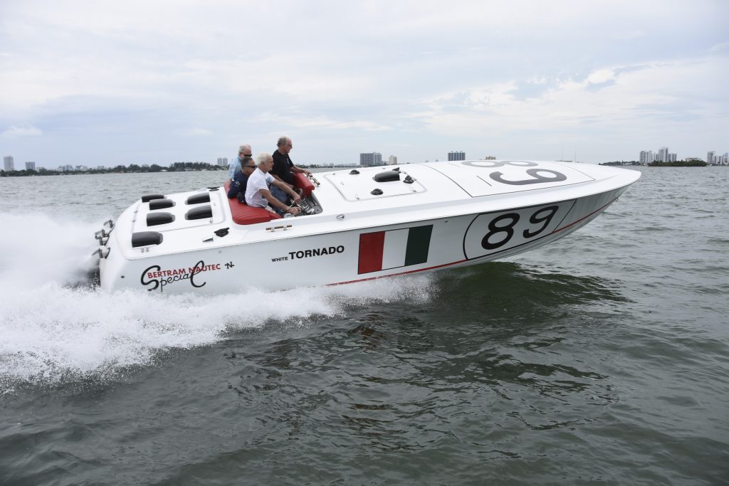 Sam James, who ran the Bertram racing team in the late 1960s and early 1970s, takes the helm of White Tornado during sea trials off Miami, Florida, last spring.