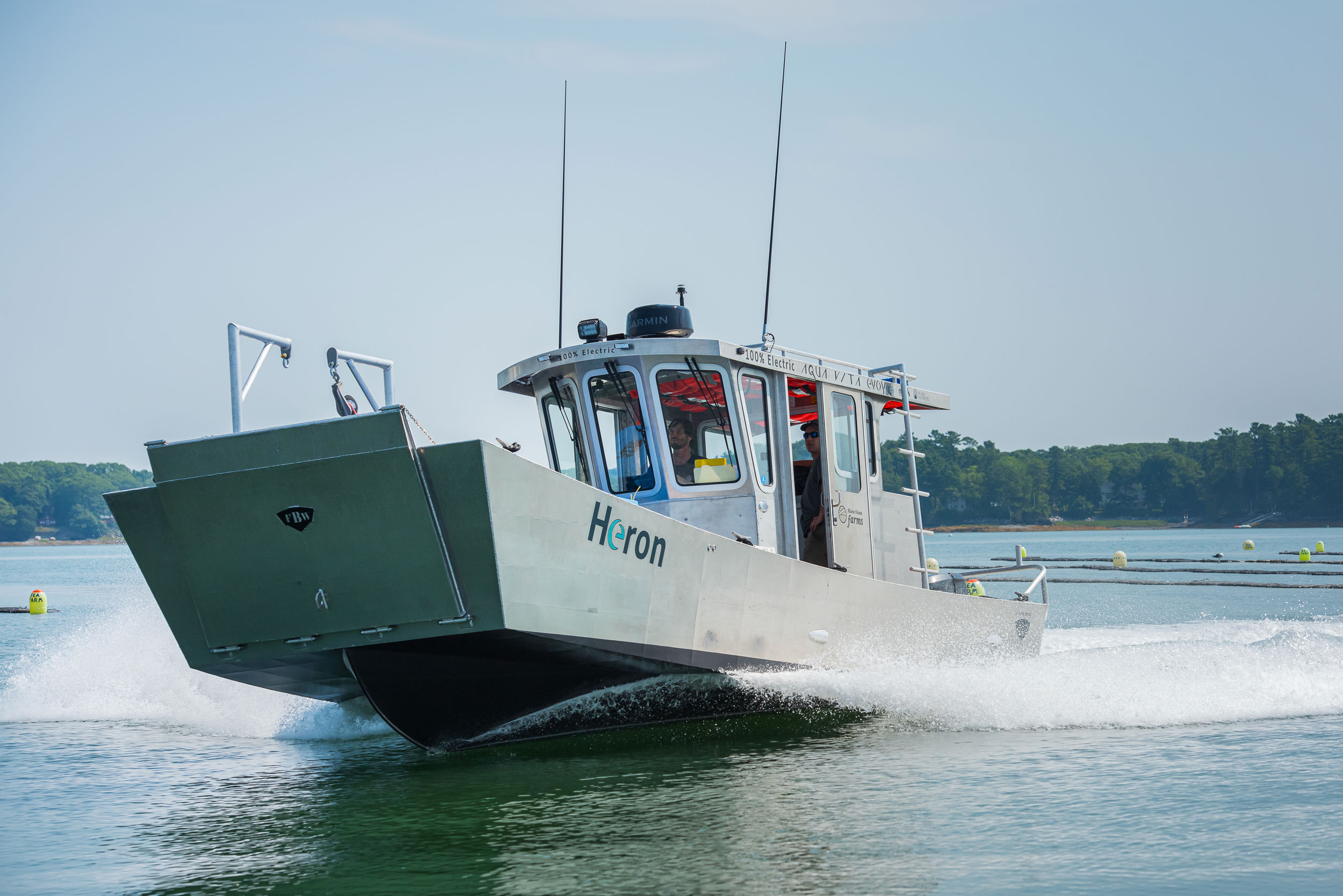 Electric-powered HERON boat on the water.